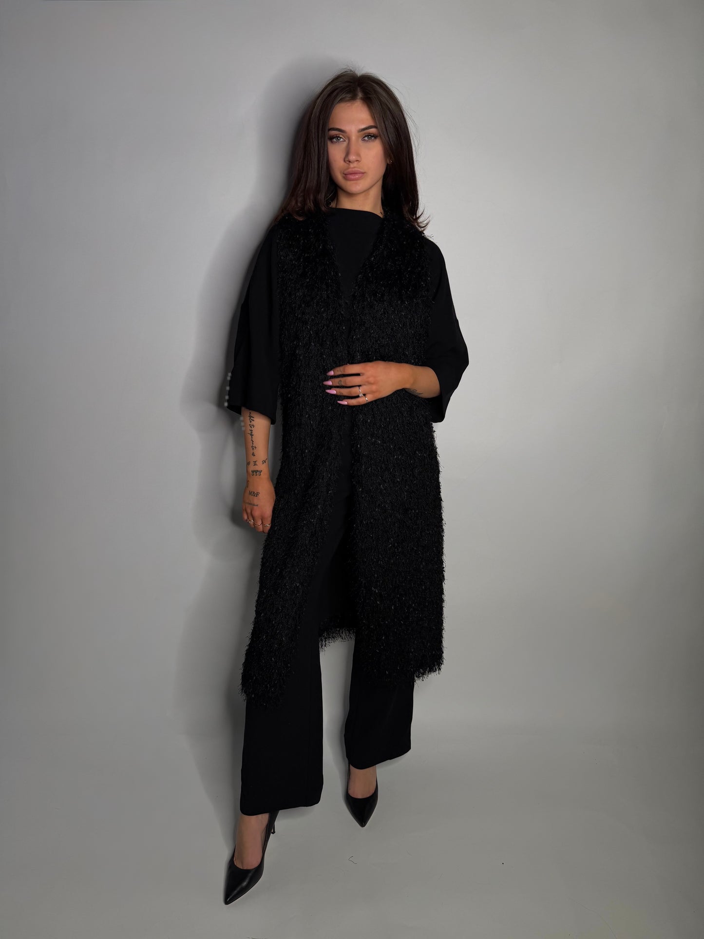 Elegant textured long vest.