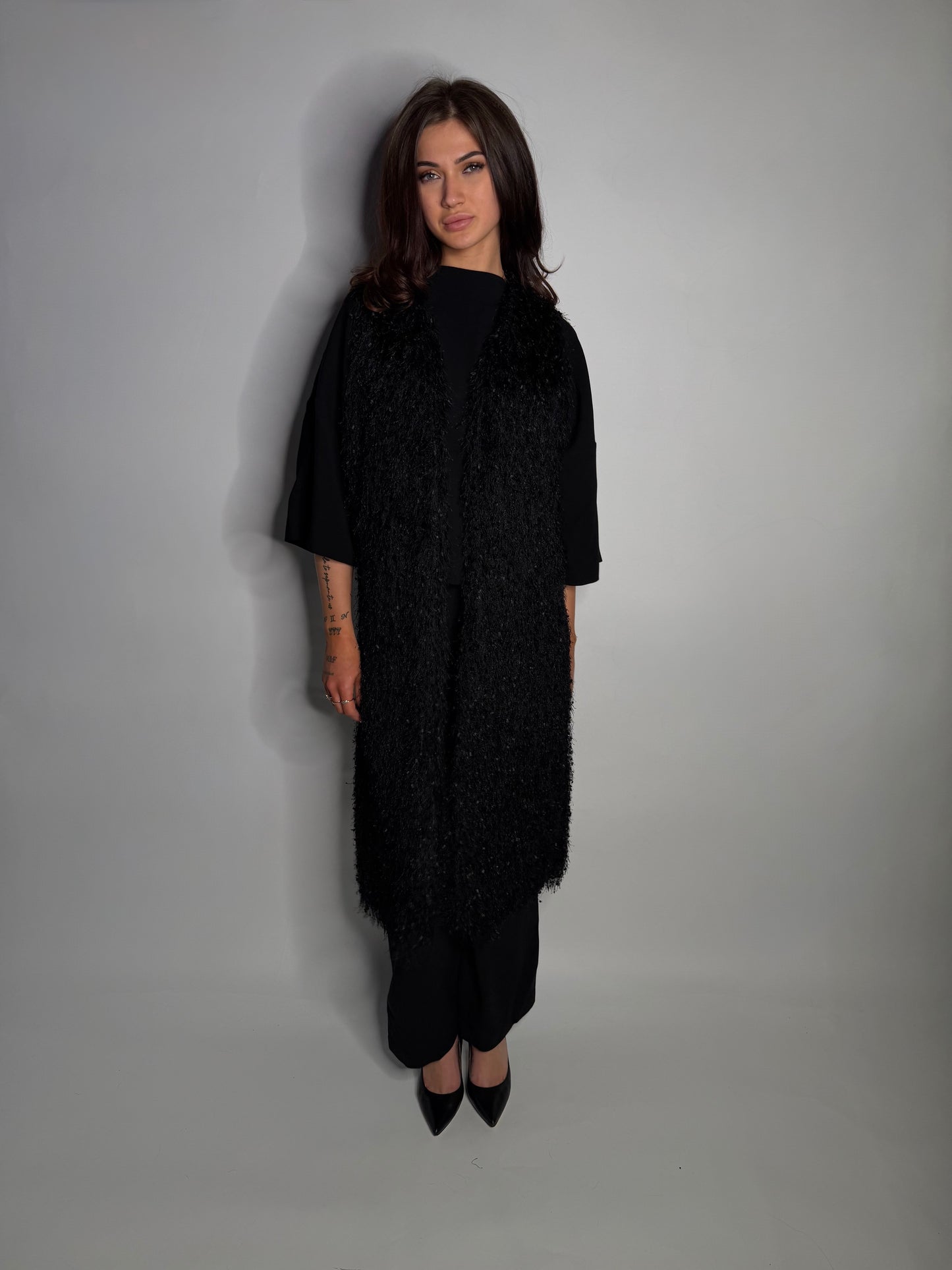 Elegant textured long vest.